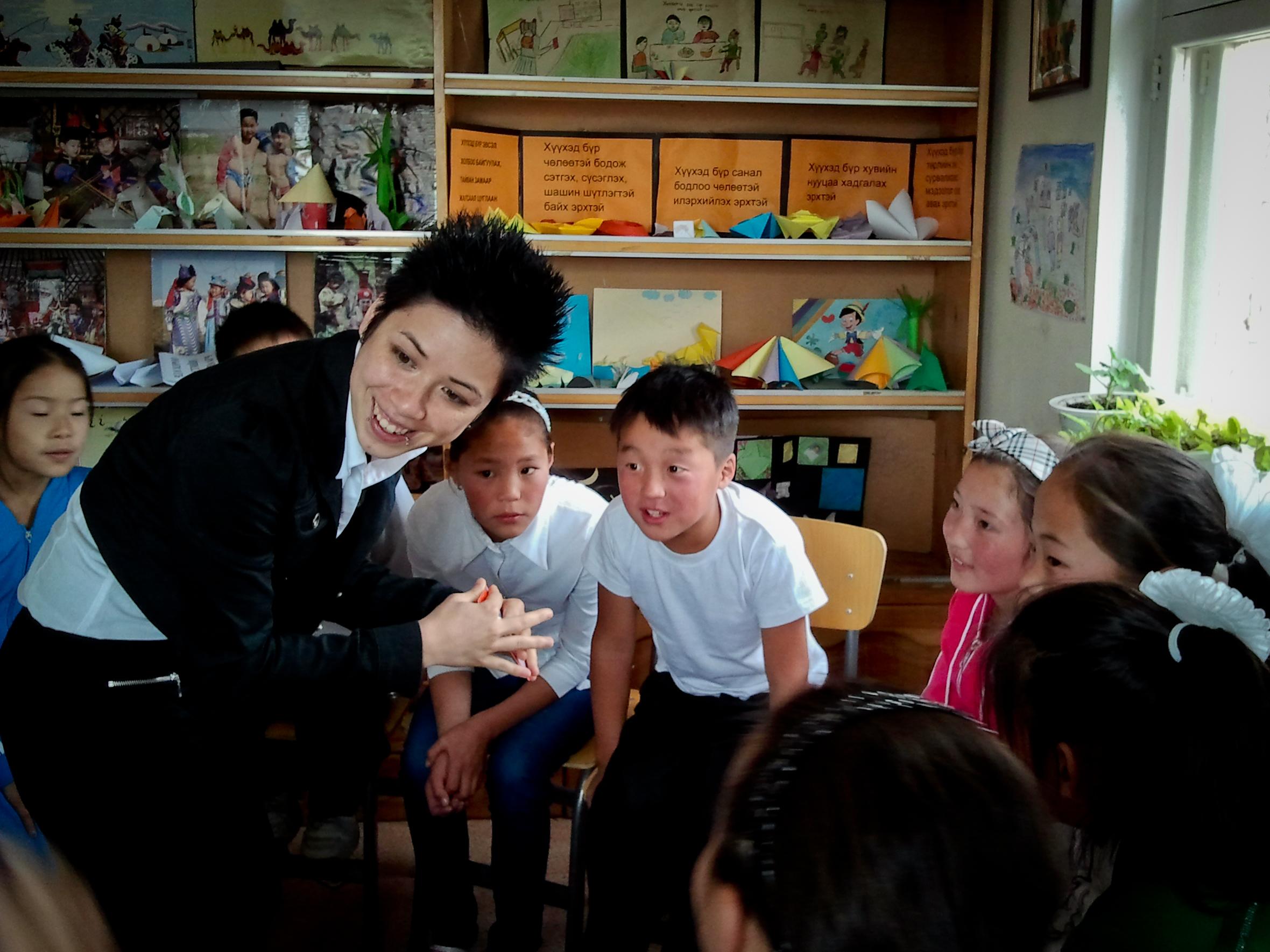 An intern works with a group of children while gaining social work experience in Mongolia A Projects Abroad intern runs an activity as part of her Social Work internship in Mongolia